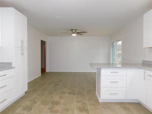 wooden floor in a white room