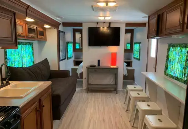 a living room with furniture and a flat screen tv