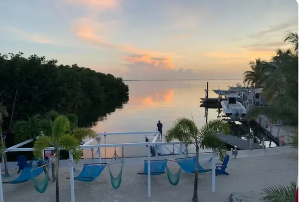 a view of a patio with chairs and a table