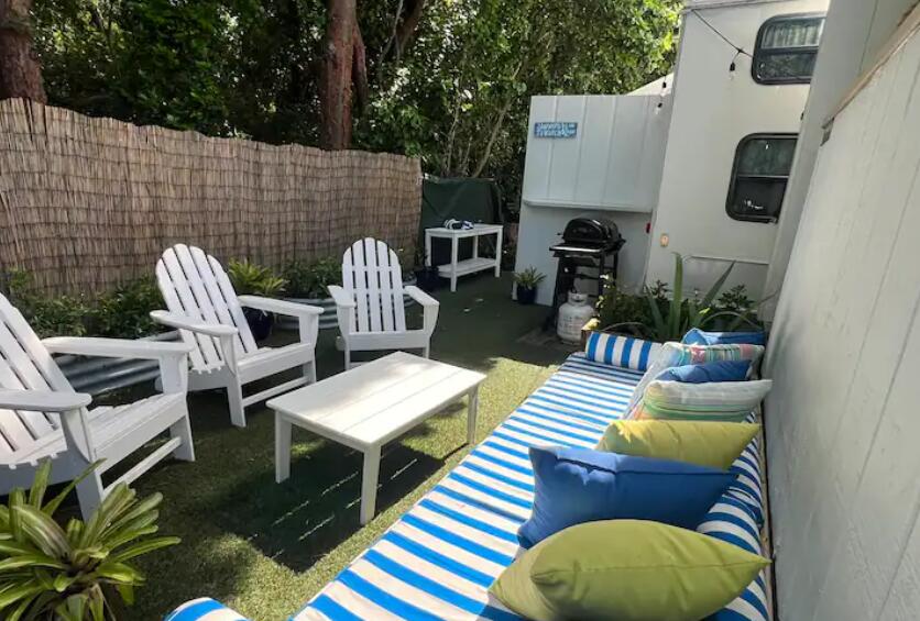 325 Calusa Street, Unit 121 Key Largo, FL 33037 - Photo 12 of 21 a view of a patio with chairs and a table