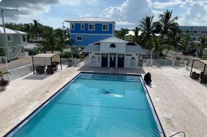 325 Calusa Street, Unit 121 Key Largo, FL 33037 - Photo 13 of 21 swimming pool view with a seating space and furniture