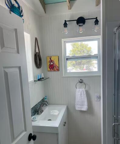 325 Calusa Street, Unit 121 Key Largo, FL 33037 - Photo 14 of 21 a bathroom with a sink and a window