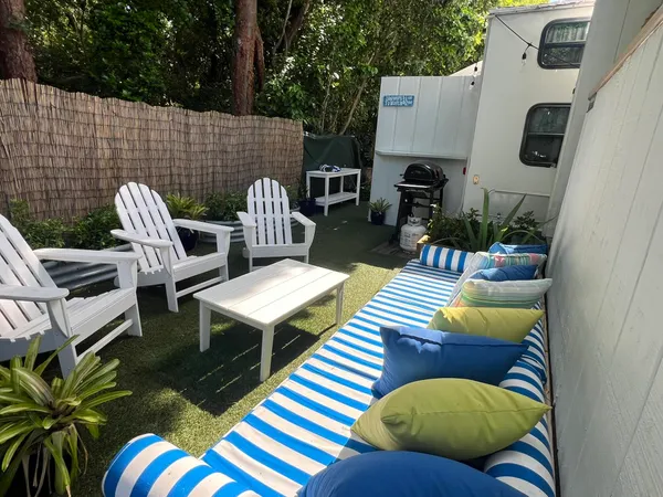 a view of a patio in the backyard