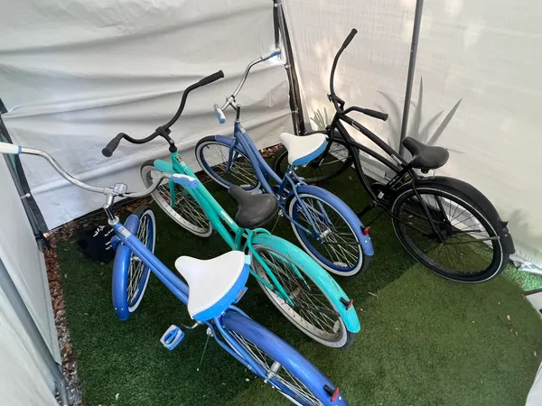 a living room with furniture and a open kitchen view
