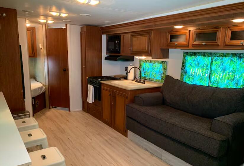 325 Calusa Street, Unit 121 Key Largo, FL 33037 - Photo 7 of 21 a living room with furniture and a open kitchen view