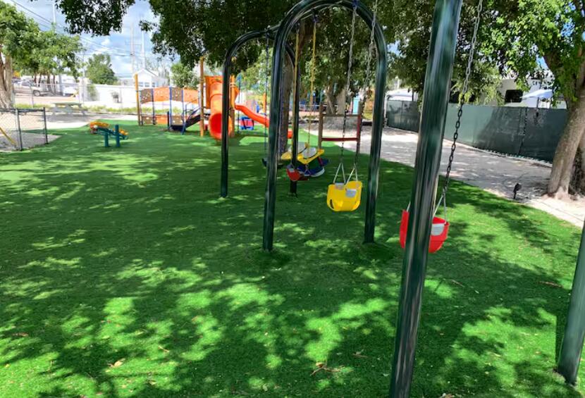 325 Calusa Street, Unit 121 Key Largo, FL 33037 - Photo 8 of 21 a view of a garden with a slide