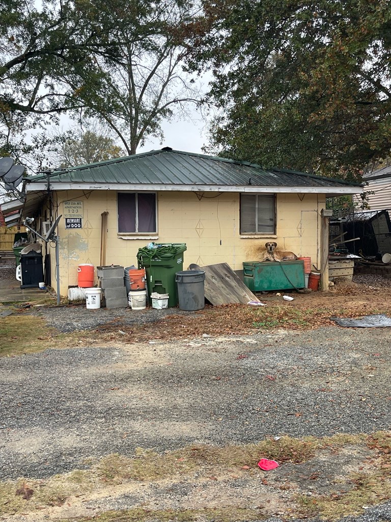 4915 11th Avenue Columbus, GA 31904 - Photo 2 of 2 a front view of a house with cars parked