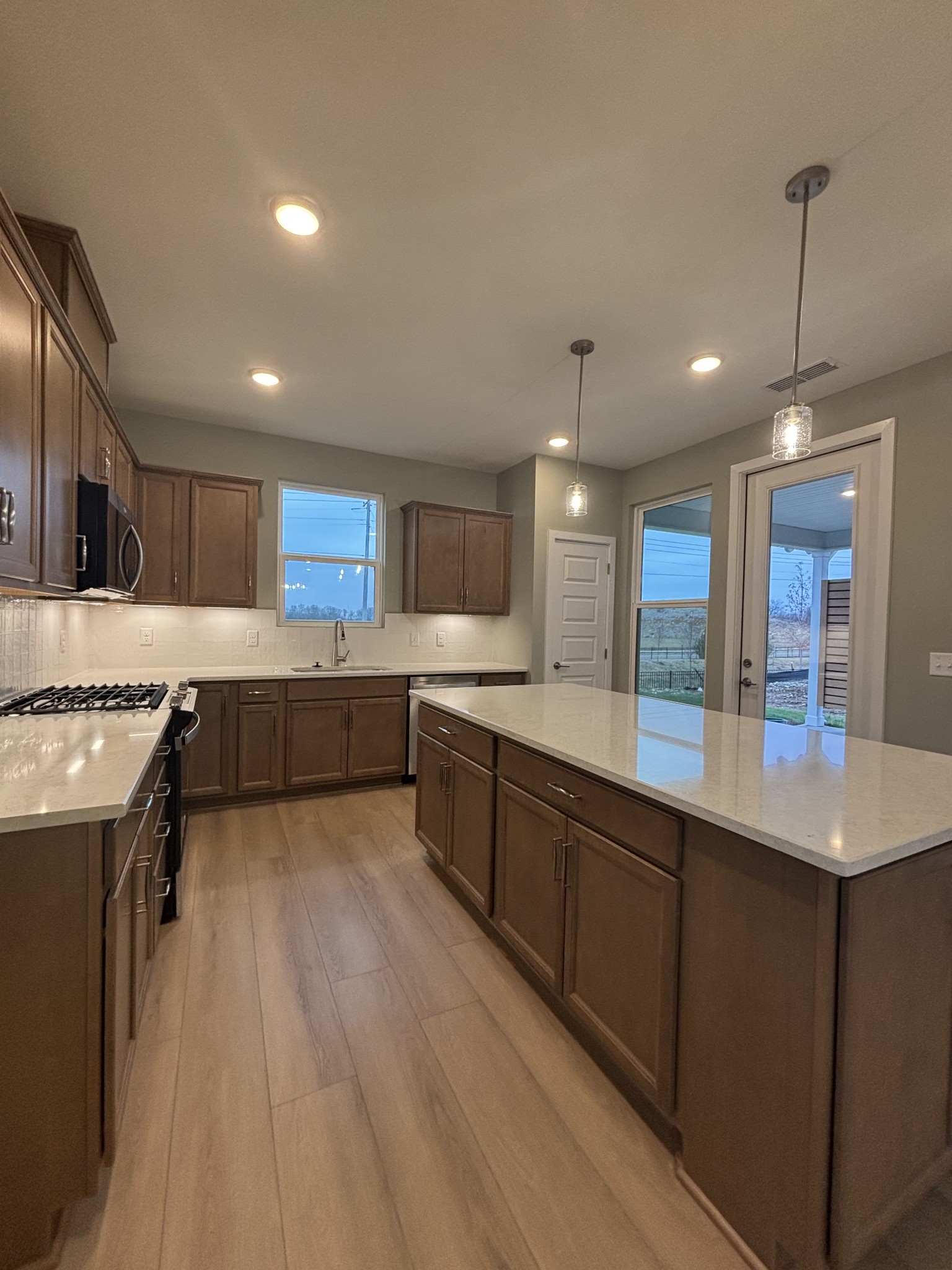 512 Scarlet Oak Road Lebanon, TN 37090 - Photo 8 of 26 a large kitchen with kitchen island a sink stainless steel appliances and cabinets