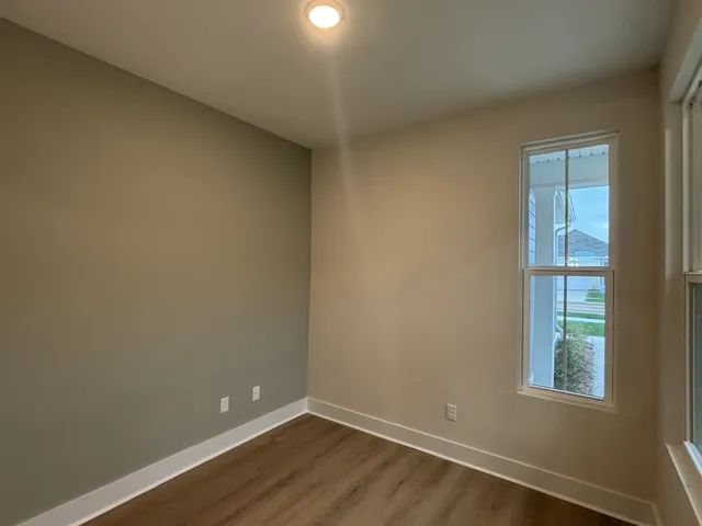 a bathroom with a shower and a glass door