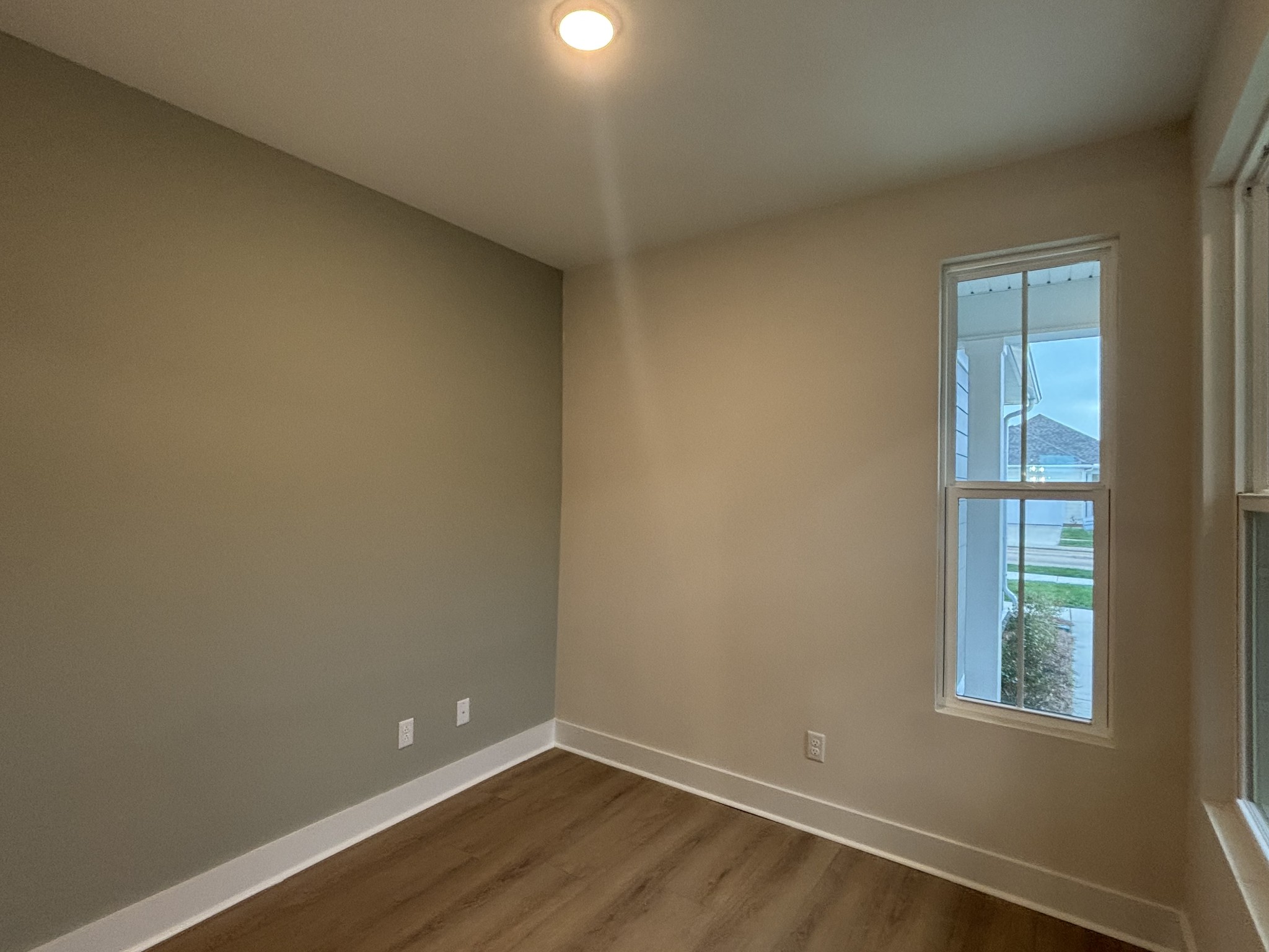 512 Scarlet Oak Road Lebanon, TN 37090 - Photo 10 of 26 an empty room with wooden floor and windows