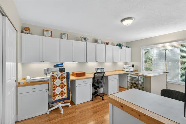 a kitchen that has a sink and a stove in it