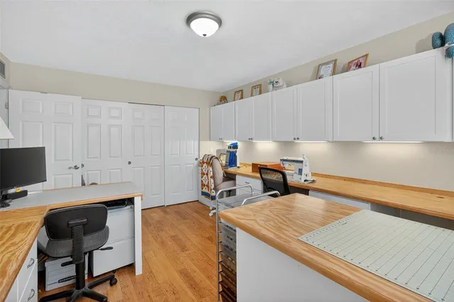 a bathroom with a granite countertop bathtub shower sink mirror and toilet