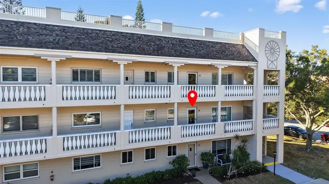 a aerial view of a house with a yard and potted plants