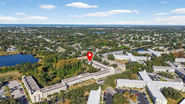a dining room with a wooden table and chairs