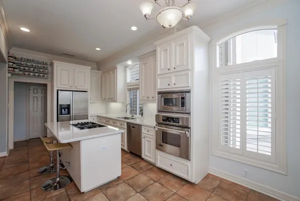 a bedroom with a bed and a ceiling fan