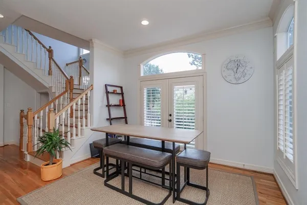 a spacious bedroom with a bed and a chandelier