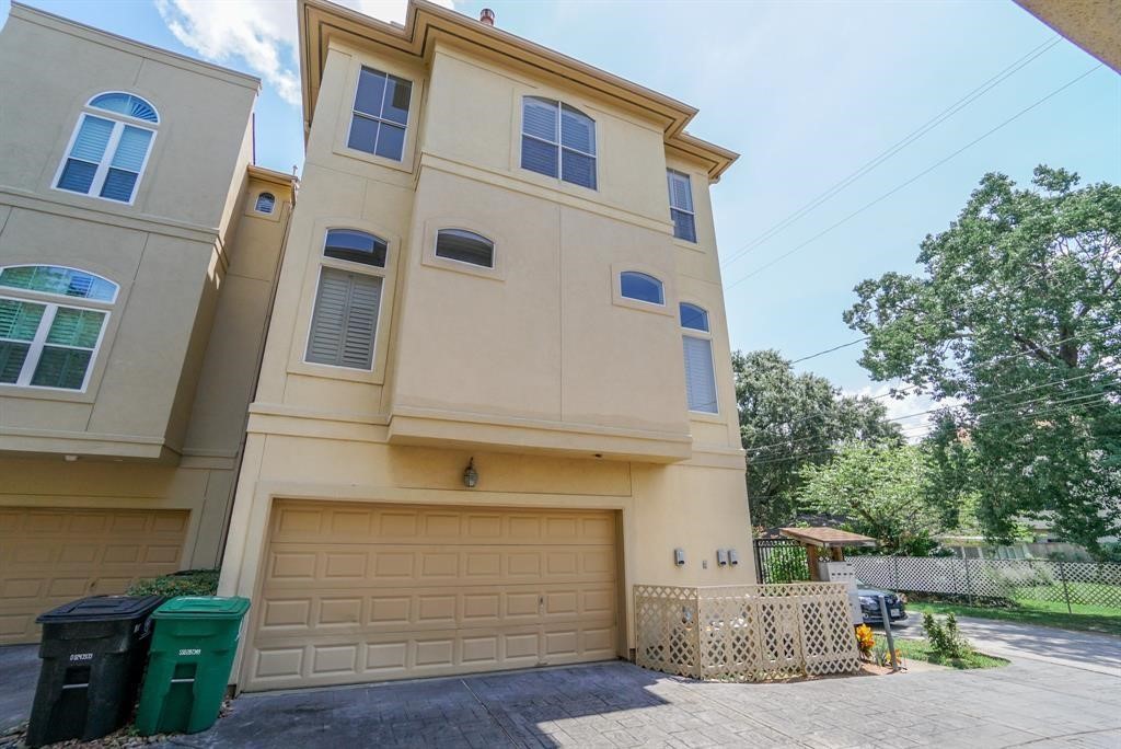 4406 Feagan Street, Unit A Houston, TX 77007 - Photo 2 of 29 a front view of a house with a garage