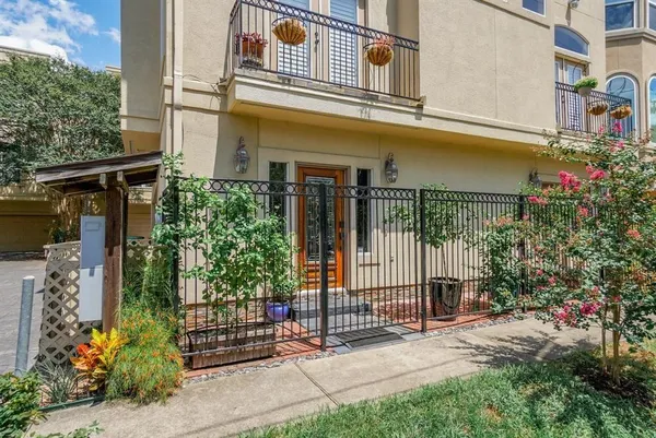 a kitchen with stainless steel appliances kitchen island hardwood floor stove sink a table and chairs in it