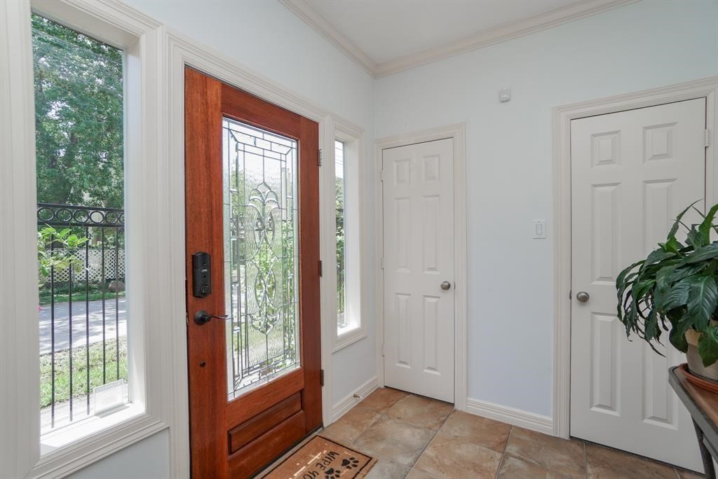 4406 Feagan Street, Unit A Houston, TX 77007 - Photo 4 of 29 a view of an entryway with wooden floor and front door