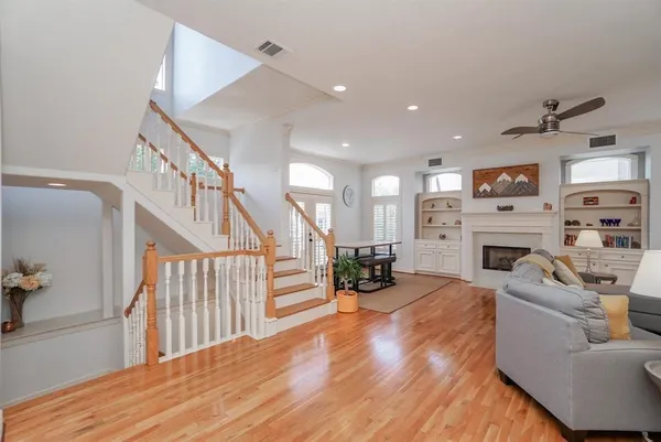 a room with furniture and potted plants