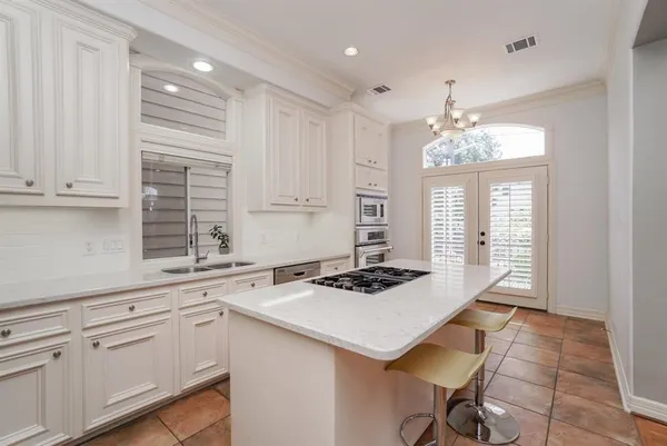 a living room with furniture a rug and a flat screen tv
