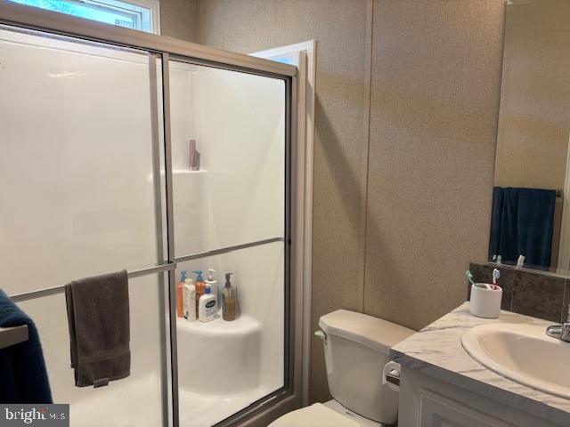 31706 Janice Road Lewes, DE 19958 - Photo 9 of 20 a bathroom with a sink toilet and shower