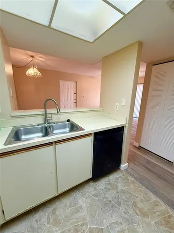 a kitchen with a sink and cabinets