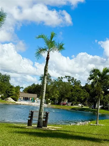 a view of a lake with a big yard