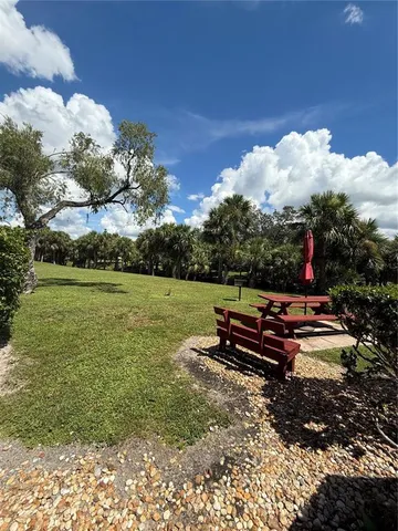 a garden view with a bench in the garden