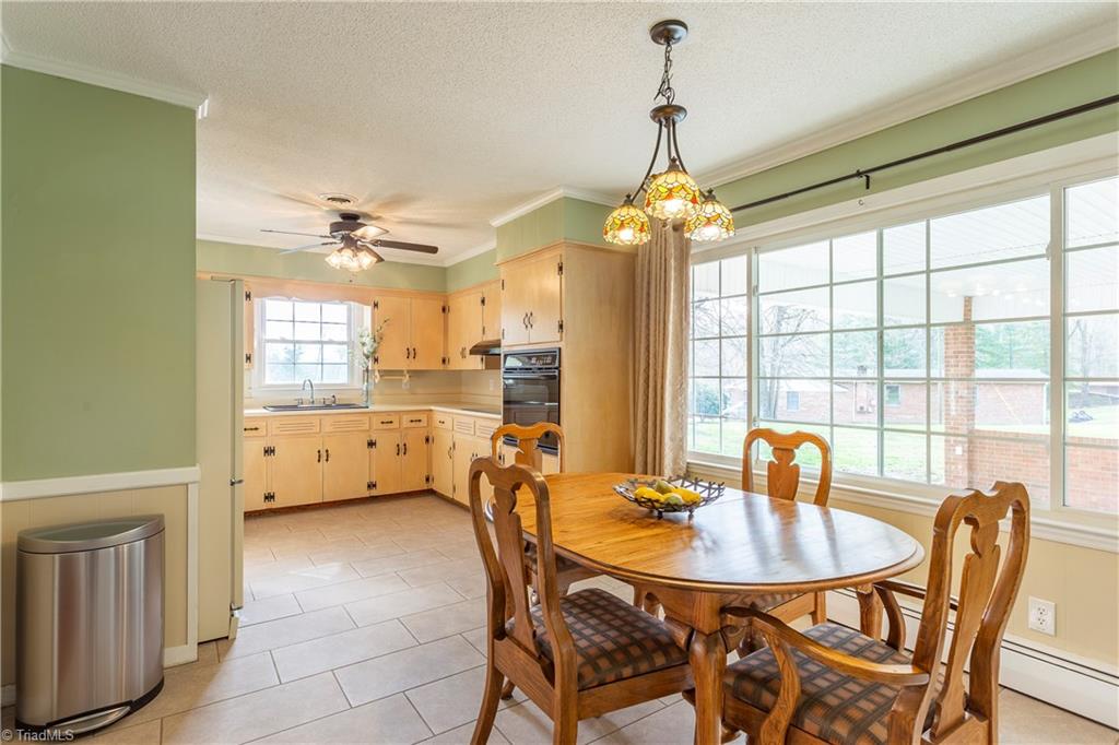 5104 Mockingbird Road Greensboro, NC 27406 - Photo 11 of 25 Note also the HUGE window lighting the roomy dining area!
