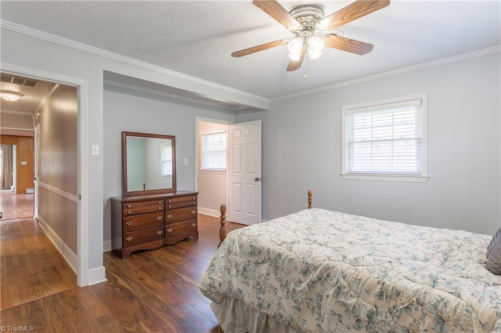 5104 Mockingbird Road Greensboro, NC 27406 - Photo 13 of 25 The Master Suite was created by expanding into a 4th bedroom, creating a spacious corner owner's suite that is hard to find in this style of home! A rare opportunity!