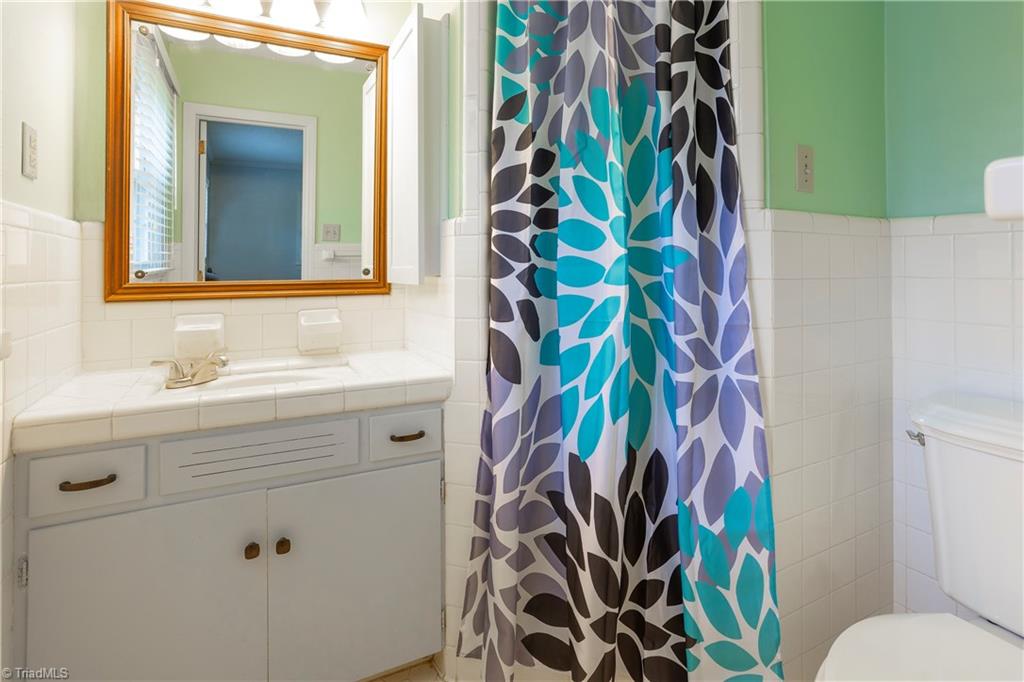 5104 Mockingbird Road Greensboro, NC 27406 - Photo 16 of 25 Classic Ranch Master Bath with Retro style features combined with modern updates! There are plans available for you to expand this bath to make it even better!