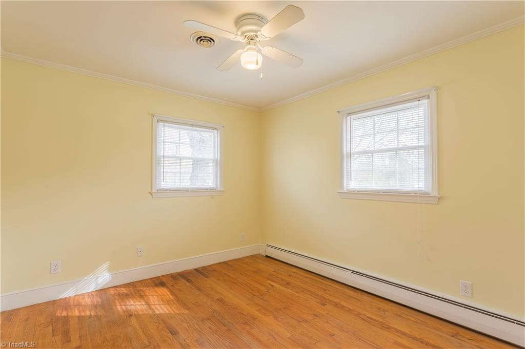 5104 Mockingbird Road Greensboro, NC 27406 - Photo 17 of 25 Bright and spacious Second Bedroom featuring hardwoods and plenty of light!