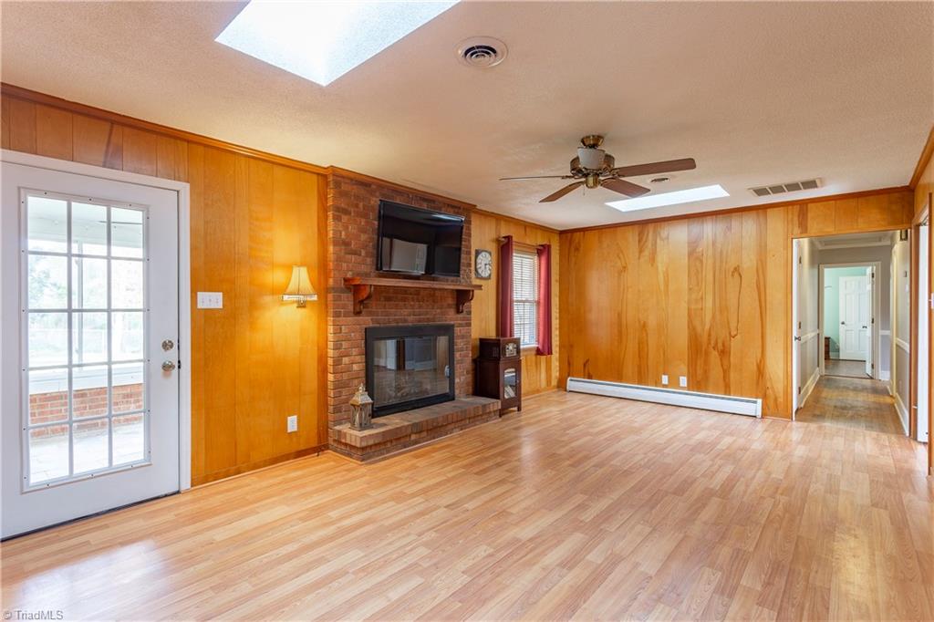The back informal Den features BRAND NEW skylights that are sure to please!