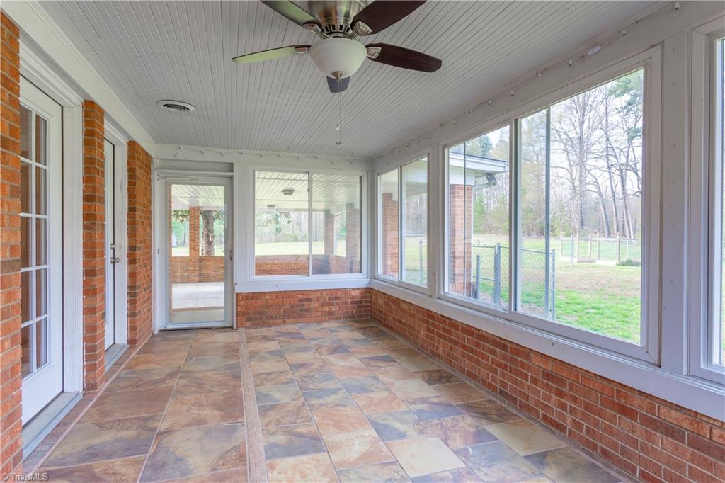 Have you seen a more appealing Sunroom lately?  Featuring LARGE sliding windows with screens for your enjoyment!