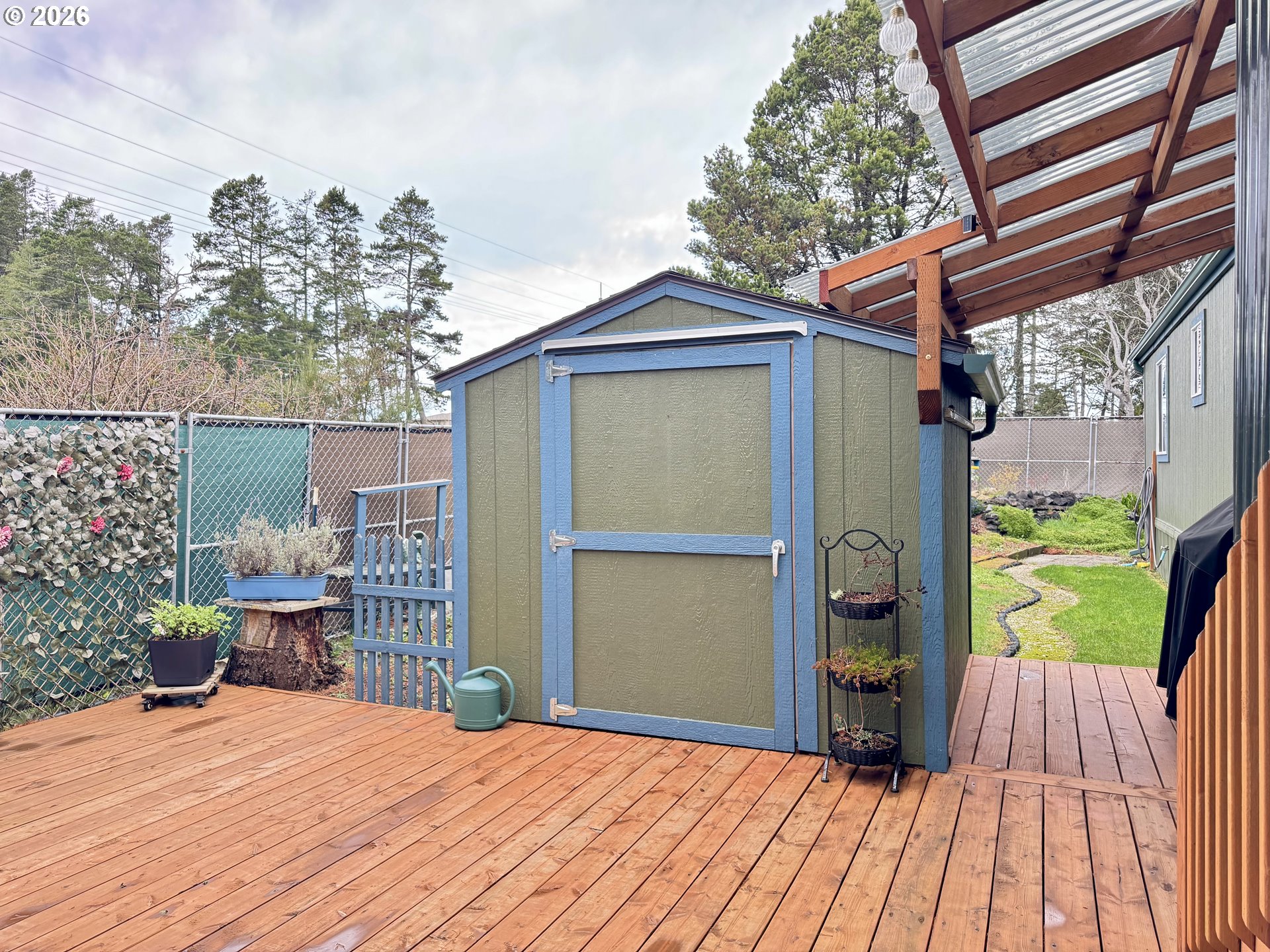 3760 Highway 101, Unit 1 Florence, OR 97439 - Photo 28 of 32 a view of backyard with cabin