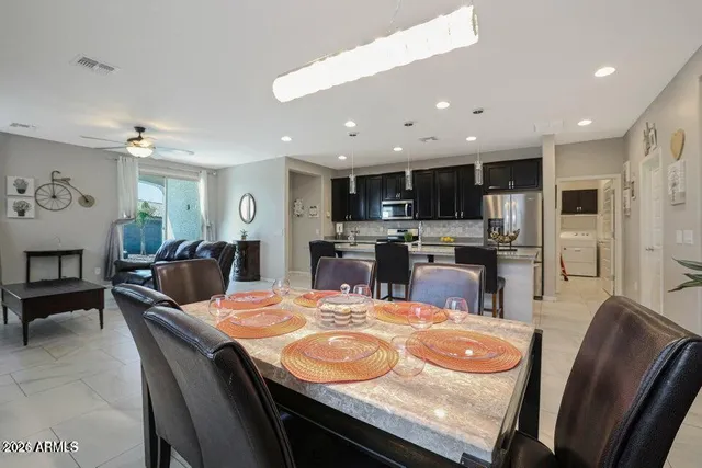 a kitchen with kitchen island granite countertop lots of counter top space and stainless steel appliances