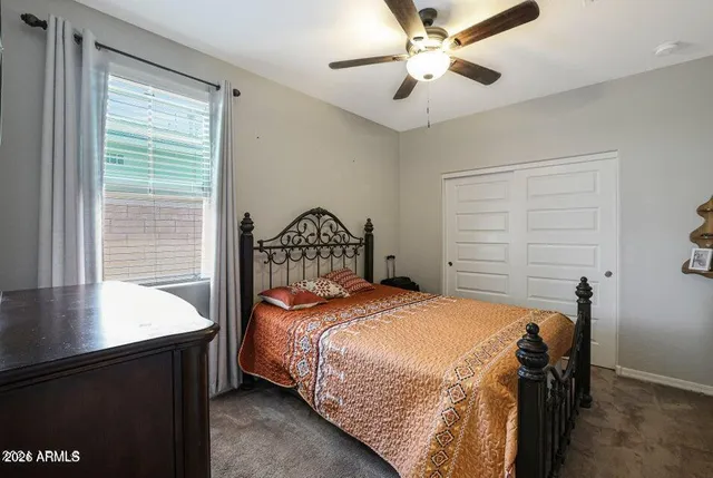 a bedroom with a bed and a table