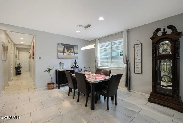 a dining room with furniture and window