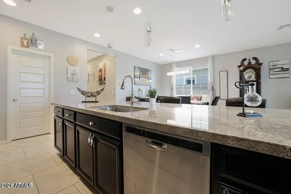 a kitchen with a sink and a refrigerator