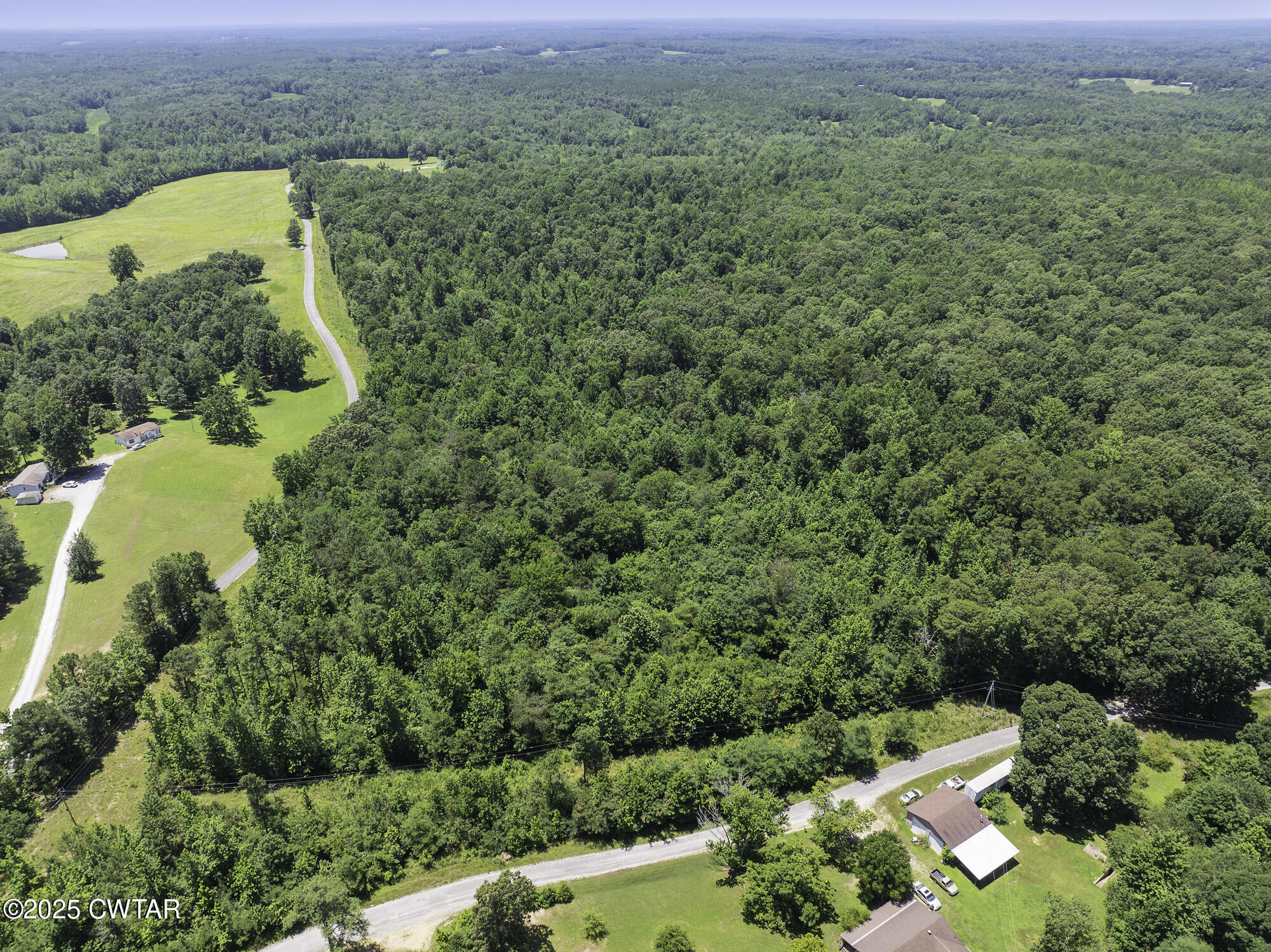 0 Jones Road Lexington, TN 38351 - Photo 11 of 28 an aerial view of residential houses with outdoor space and trees