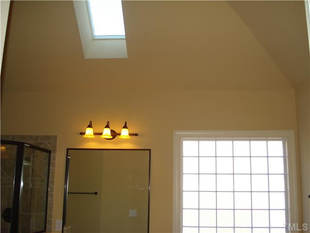 7021 Rippling Stone Lane Raleigh, NC 27612 - Photo 14 of 25 a room with a window