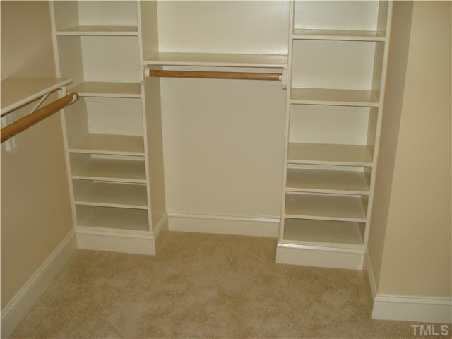 7021 Rippling Stone Lane Raleigh, NC 27612 - Photo 15 of 25 a view of walk in closet with empty racks