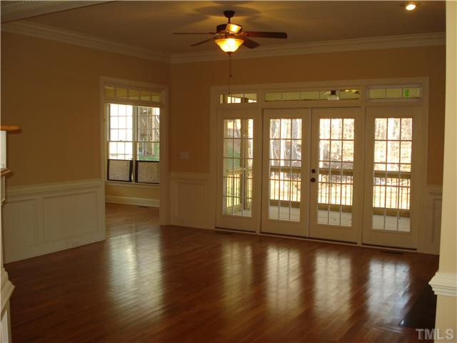 7021 Rippling Stone Lane Raleigh, NC 27612 - Photo 6 of 25 a view of an entryway with wooden floor