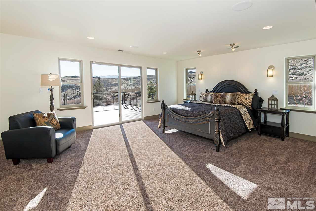4965 Mason Road Reno, NV 89506 - Photo 15 of 25 a living room with a bed furniture and a large window