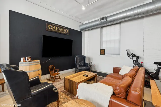 a room with lots of furniture and a flat screen tv