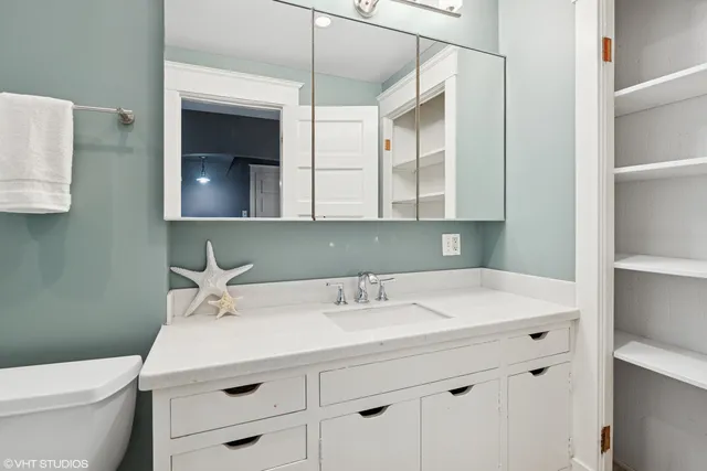 a large kitchen with stainless steel appliances granite countertop a stove and a cabinets