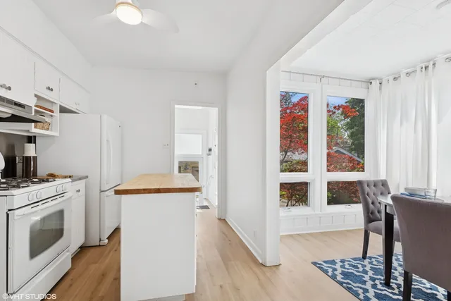 a view of a dining room with furniture and window