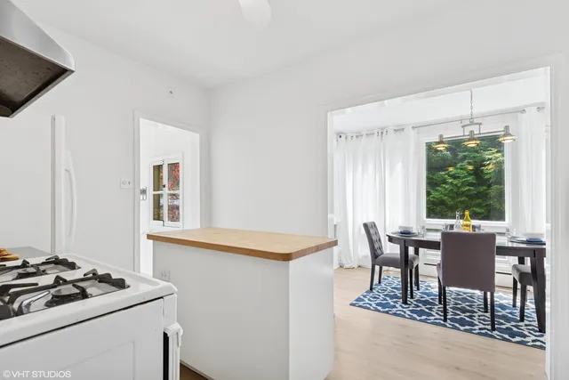 a kitchen with cabinets appliances and a sink