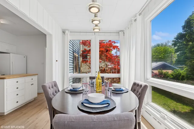 a view of a dining room with furniture window and outside view